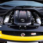 **Prompt:** A close-up shot of a Nissan GT-R's engine bay. Focus on the details, highlighting potential areas of concern for used car buyers: oil leaks, aftermarket parts, or signs of wear. Capture the complexity of the VR38DETT engine.